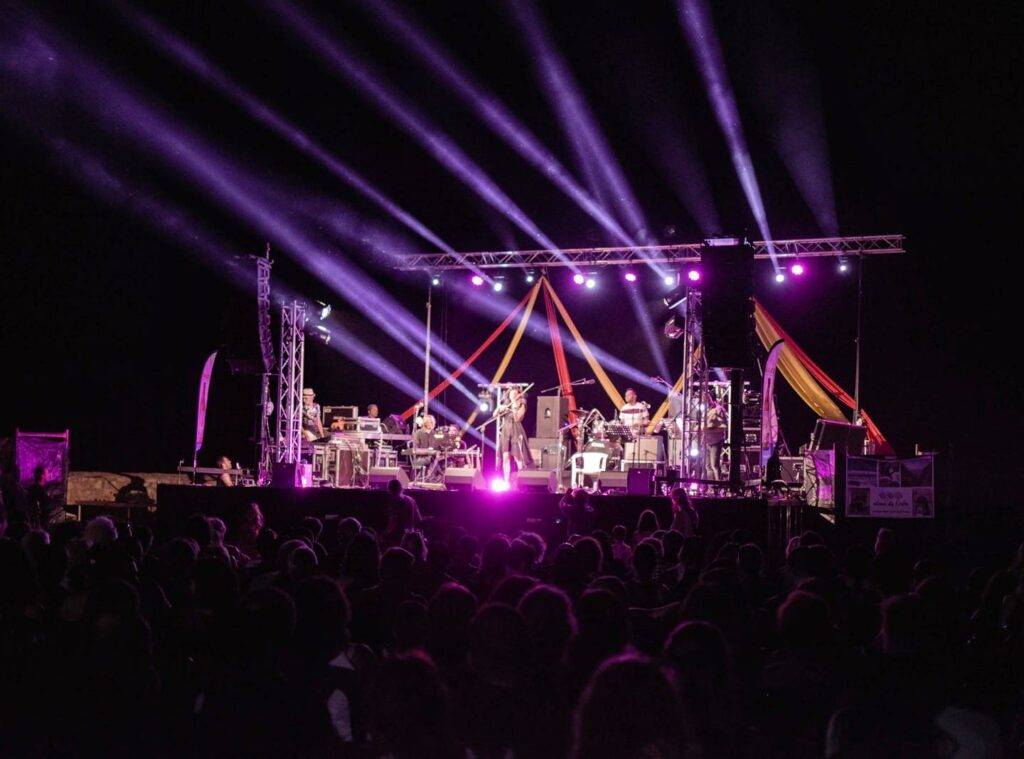 Picture of a Jazz festival in Crete showing Beam moving heads, line array sound systems and stage design elements.