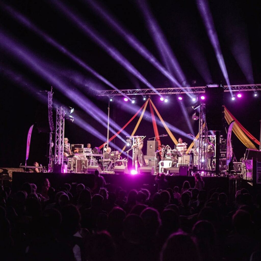 Picture of a Jazz festival in Crete showing Beam moving heads, line array sound systems and stage design elements.